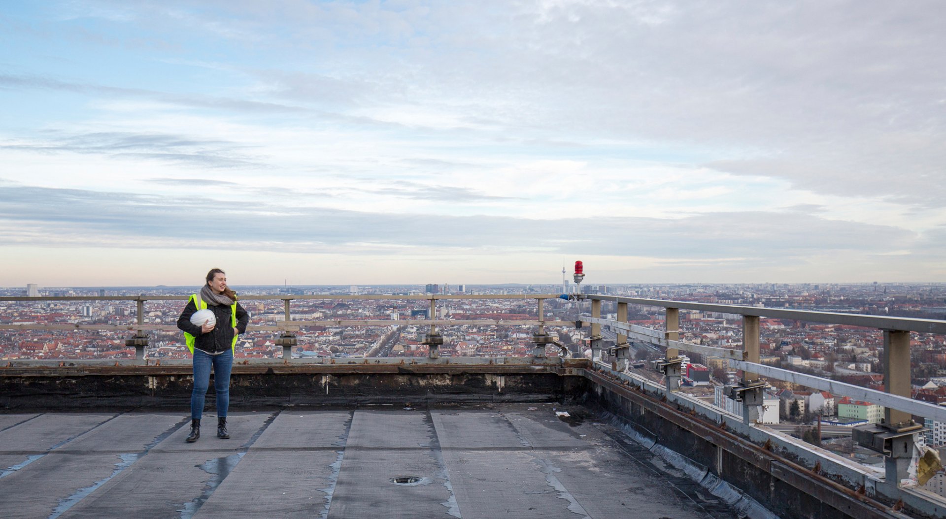 Person on a roof top under construction